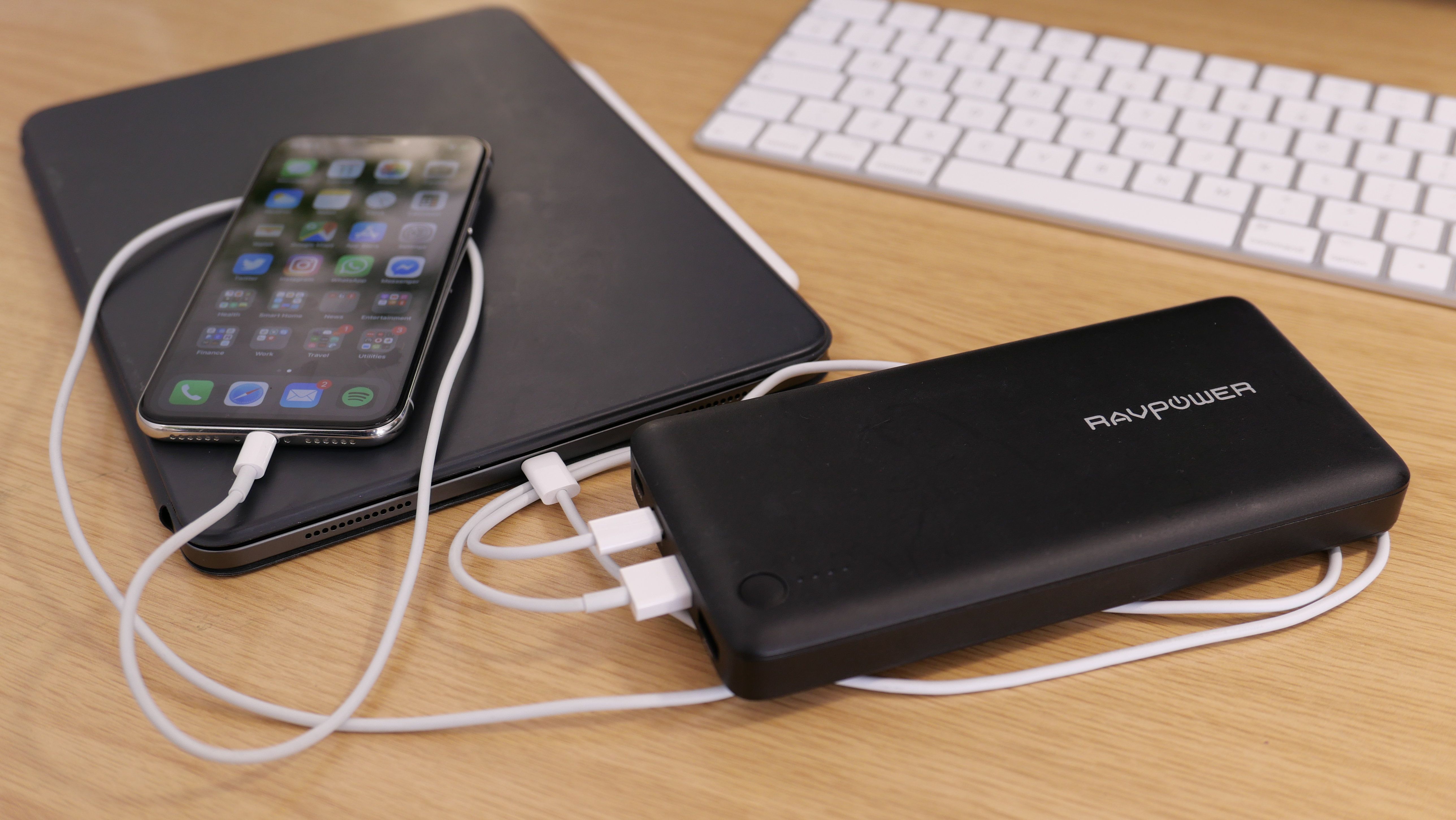 Photo of a power bank charging an iPad Pro and iPhone X