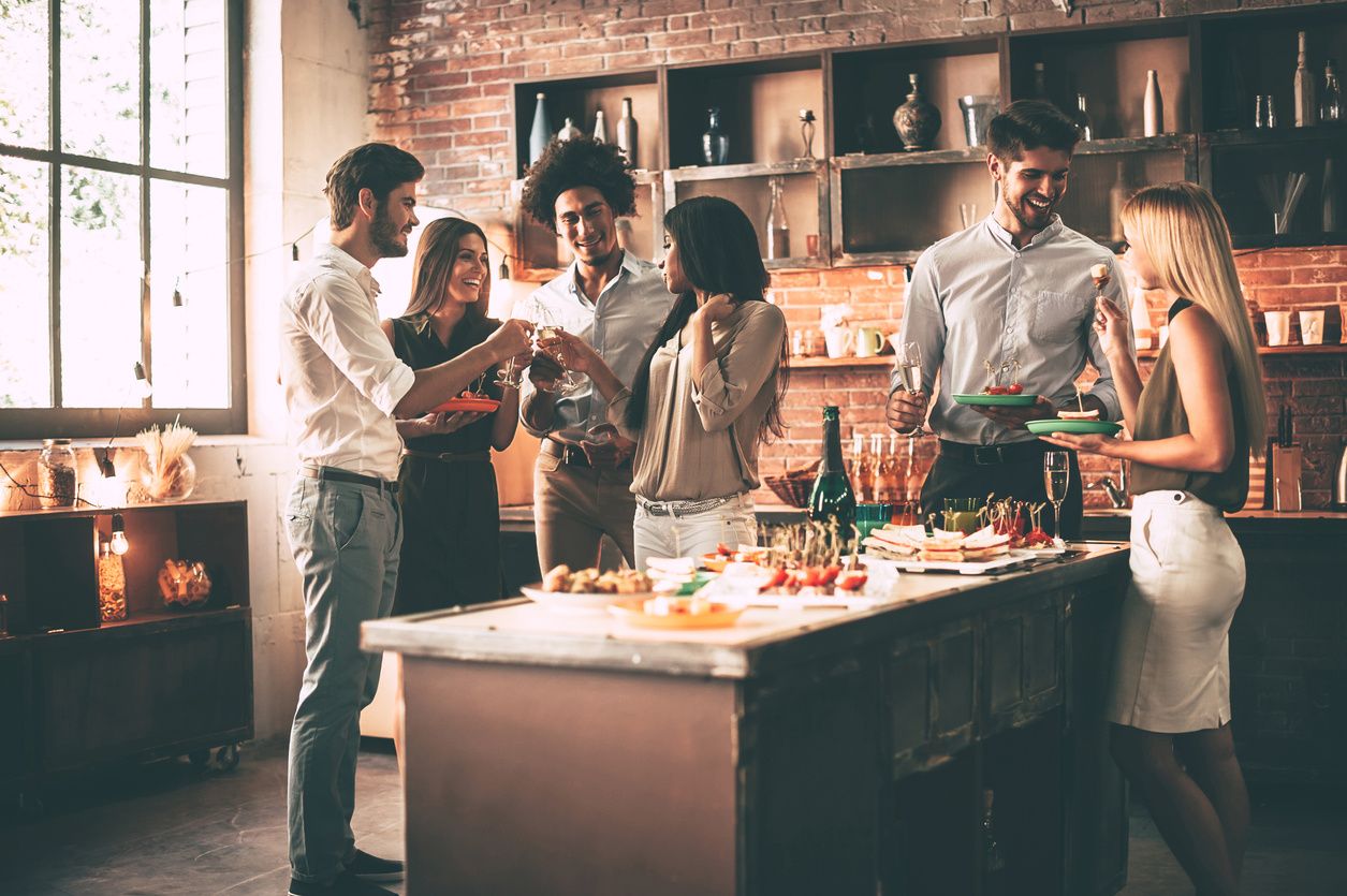 photo of people in the kitchen at a house party