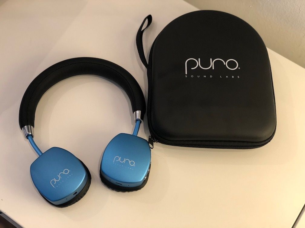 PuroQuiet Headphones in blue metallic and their carrying case