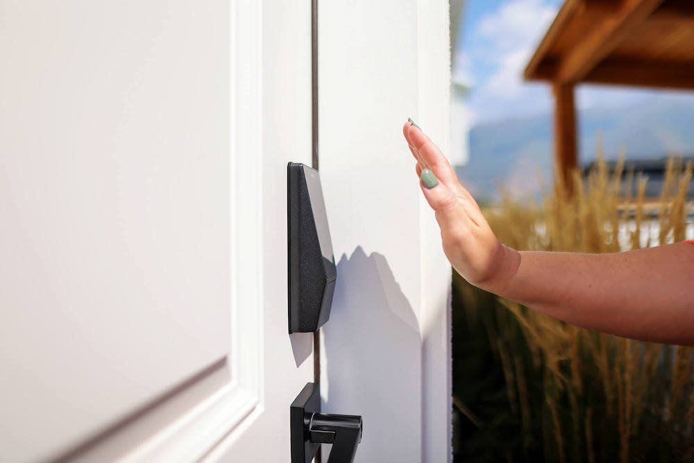 photo of a woman's hand over Wyze Palm Lock