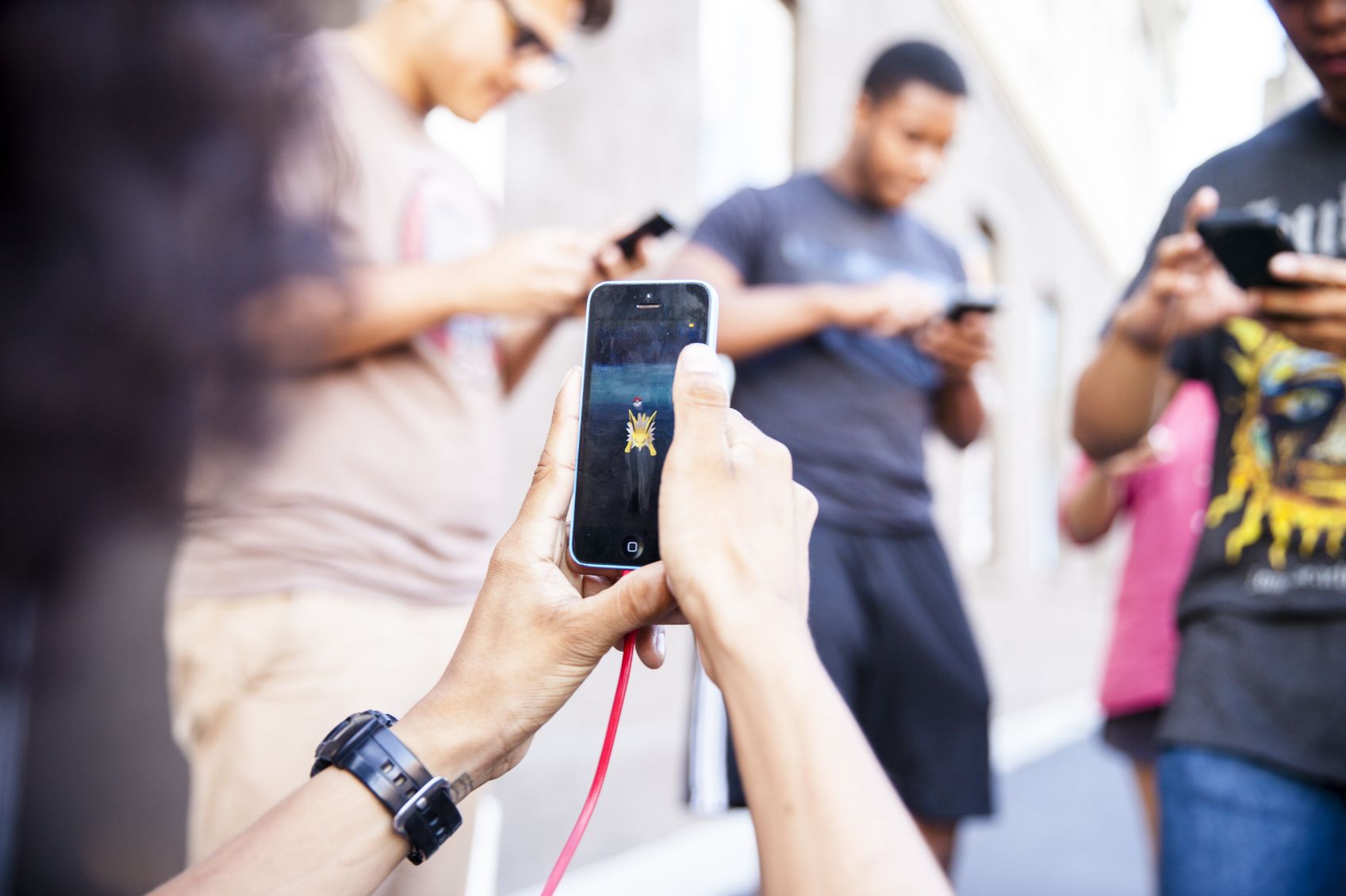 Pokémon Go players on iPhones in Fullerton, California.