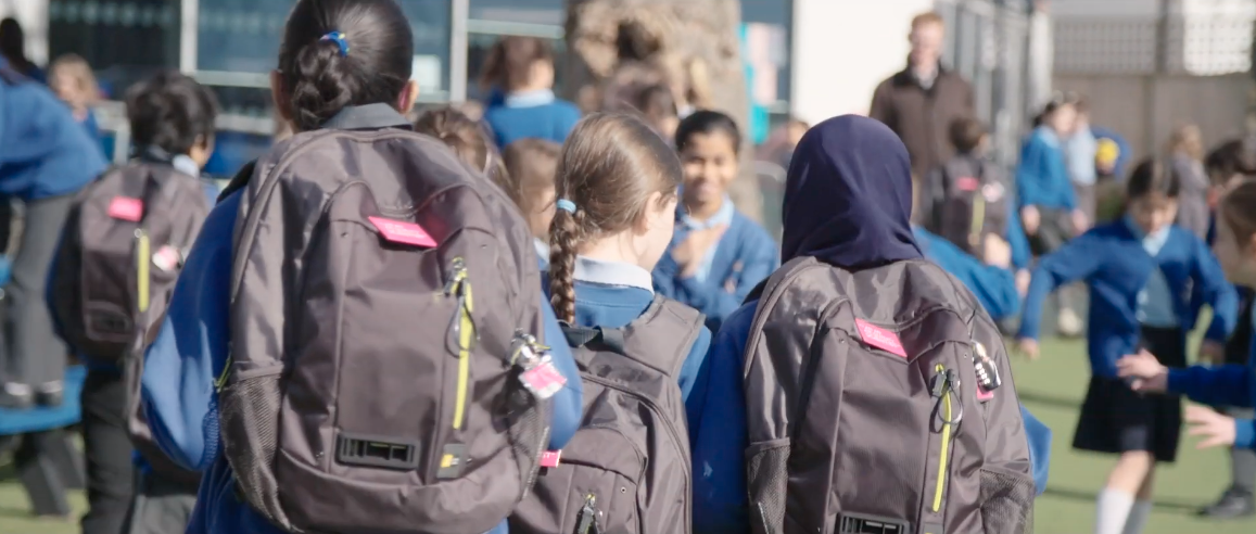 Photo of schoolchildren wearing Dyson air quality-monitoring backpack