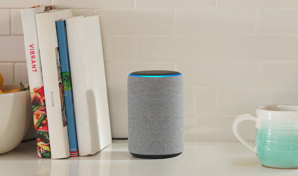 Photo of an Amazon Echo smart speaker on a bookshelf