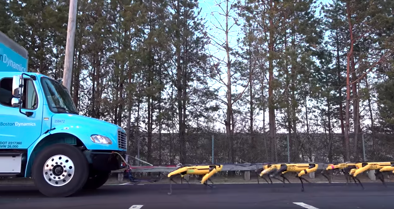 Photo of Boston Dynamics robots pulling a truck
