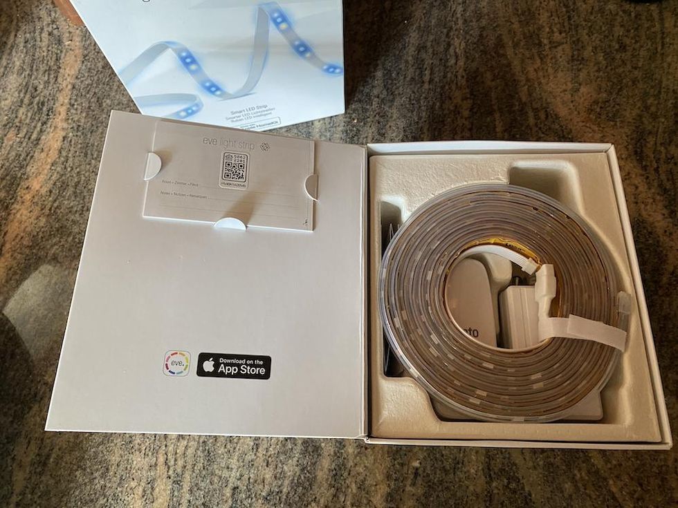 inside Eve Light Strip box on a counter.