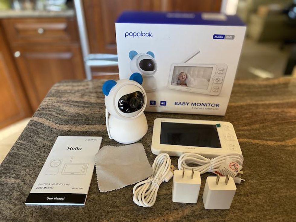 Inside the box of Papalook Smart Baby Monitor System on a countertop