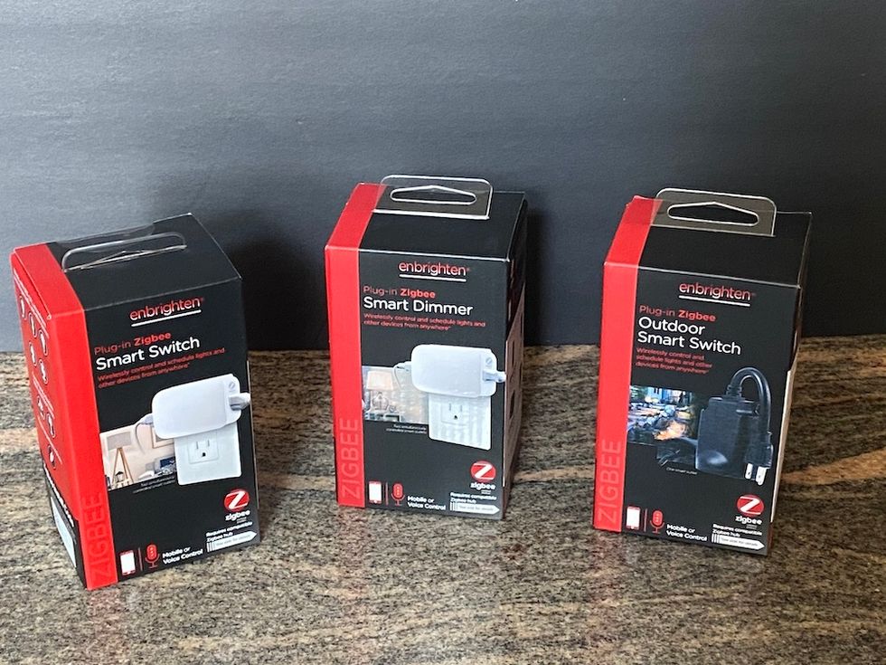 Jasco enbrighten smart plugs lineup on a countertop
