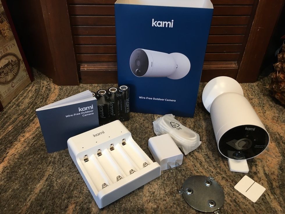 Kami Outdoor Camera unboxed on a counter