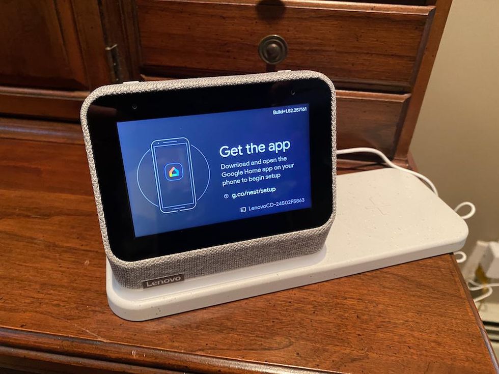 Lenovo Smart Alarm Clock Gen 2 on a table being connected to Google Home app