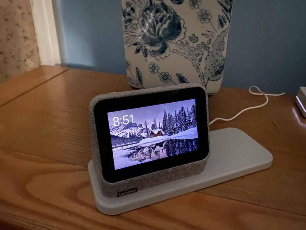 Lenovo Smart Clock Gen 2 with Charging Station and Google Assistant on a night stand.