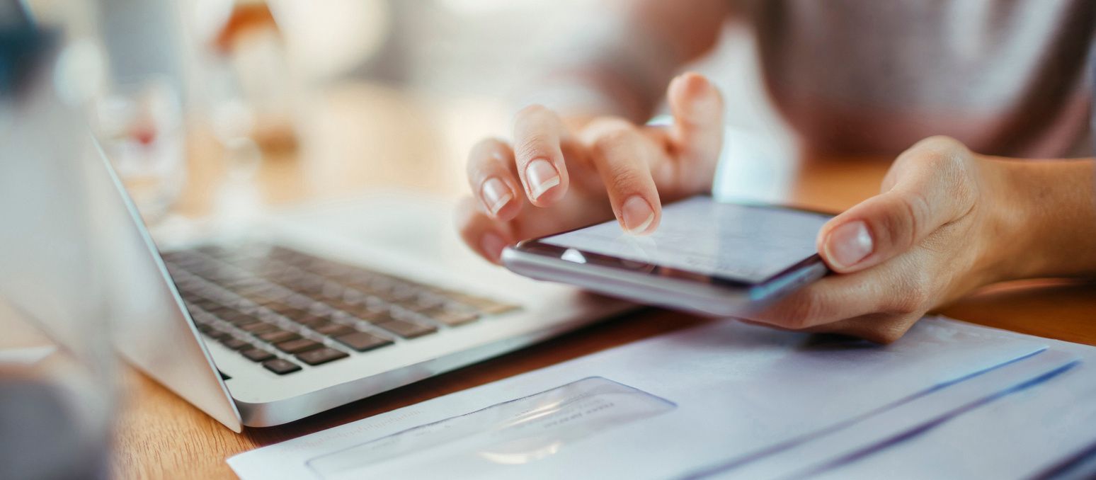 Stock image of a smartphone and laptop