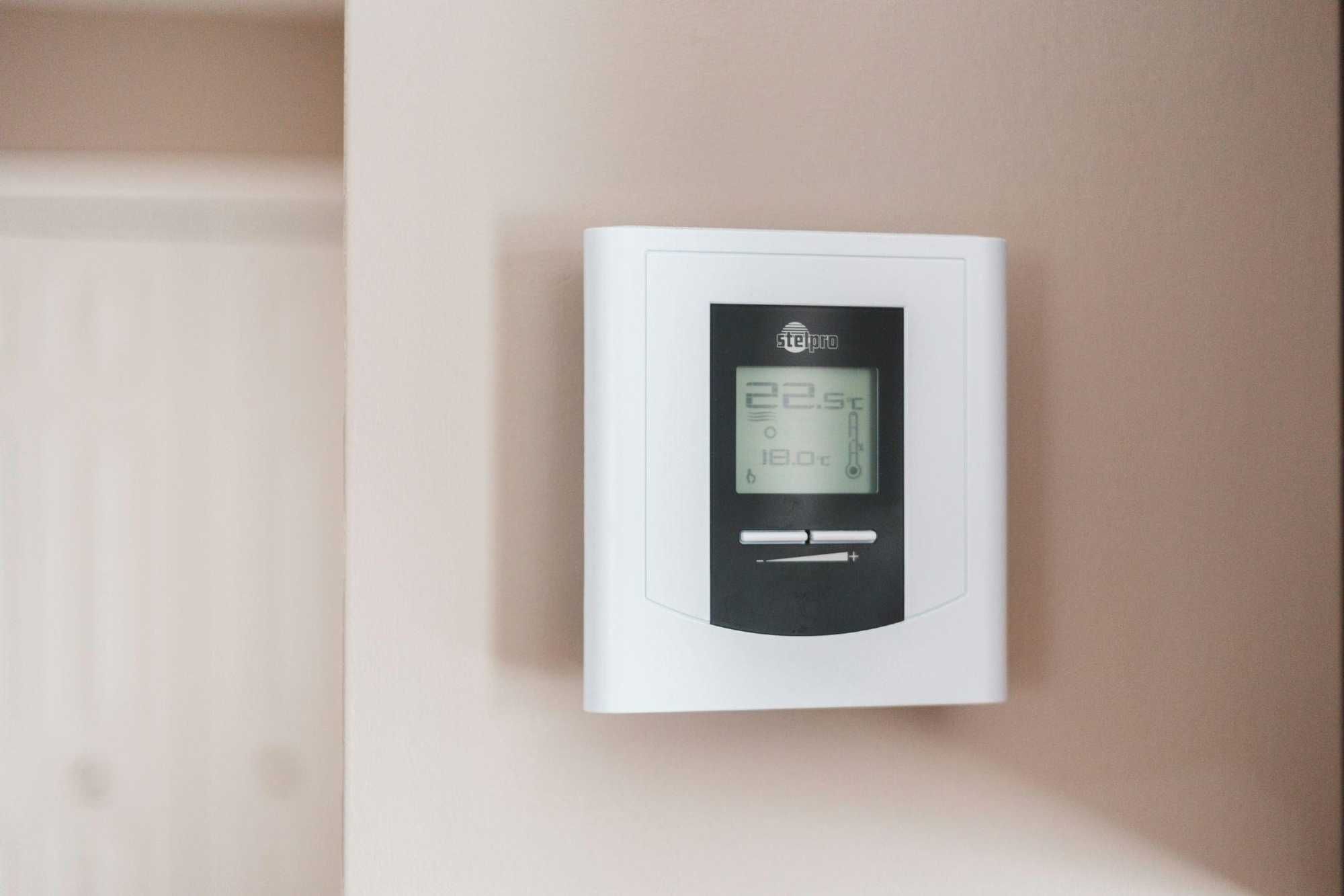 photo of a smart thermostat on the wall