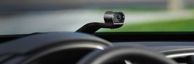 a photo of Ring Car Cam on a car's dashboard