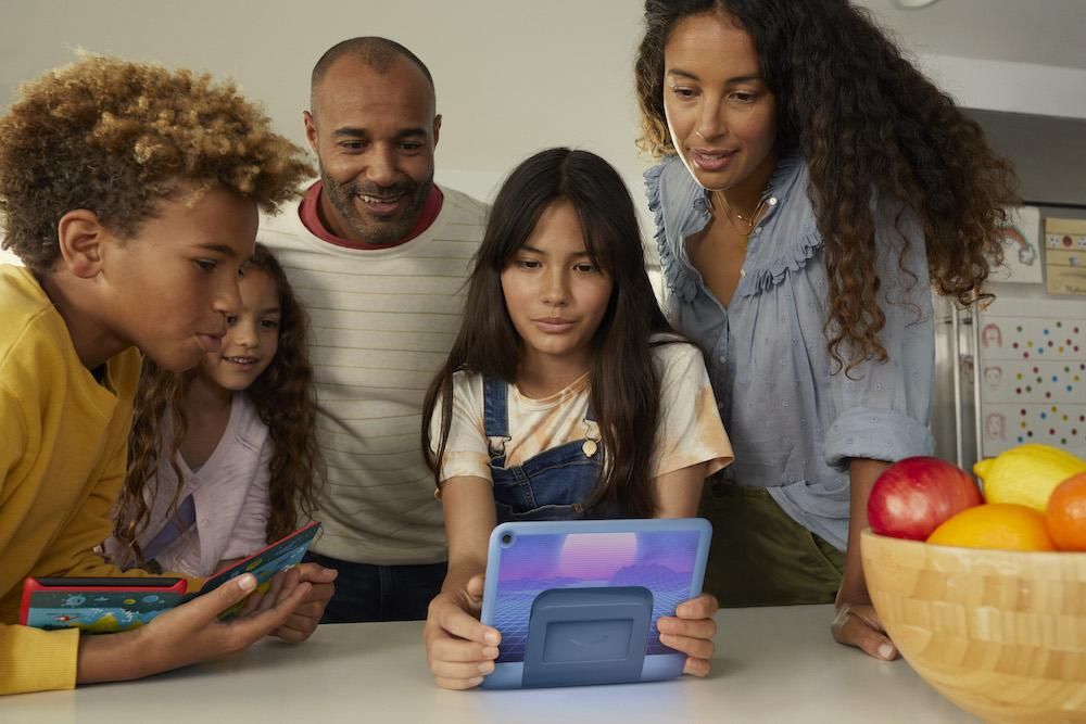 a photo of family around a new Fire HD 8 tablet pro
