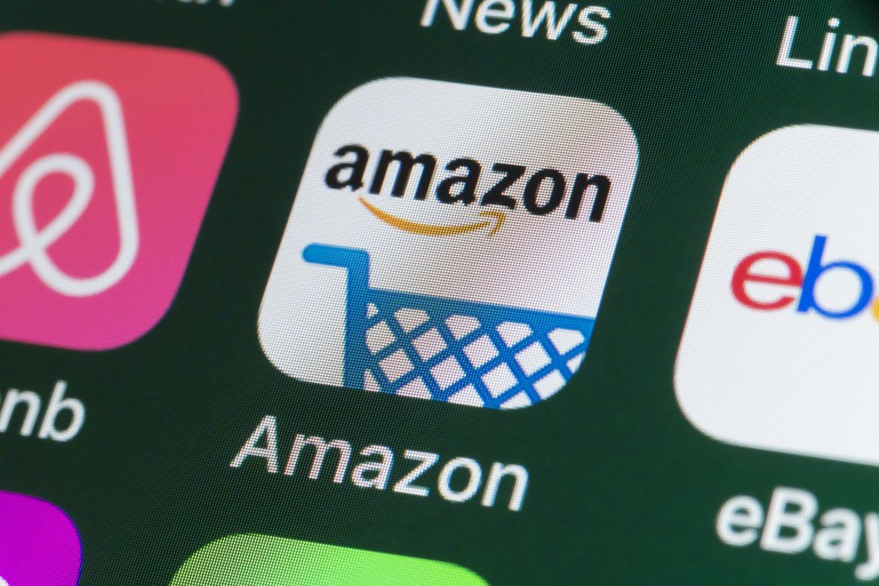 Amazon , Airbnb, ebay, News and other Apps on iPhone screen stock photo