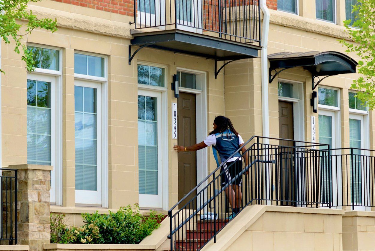 Amazon Driver Rings Doorbell stock photo