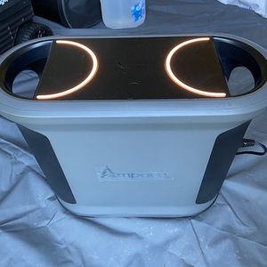 a photo of Ampace Andes 1500 in a tent powering up a inflattable mattress.