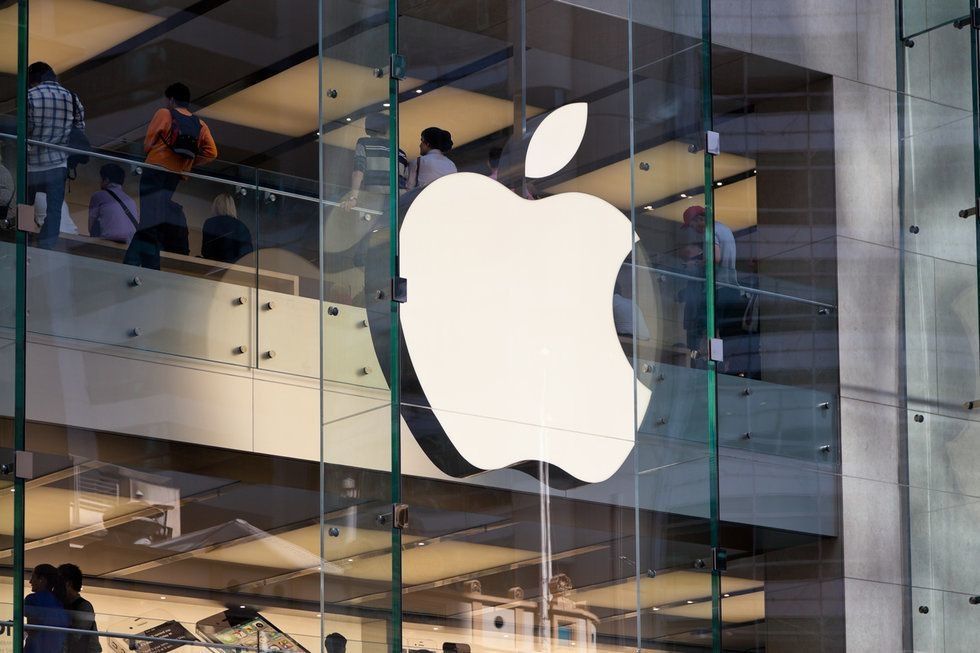 Apple logo on a glass building