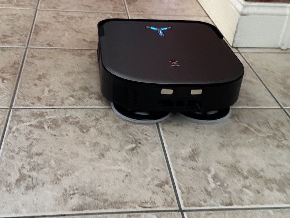 a photo of Ecovacs DEEBOT X2 OMNI Robot Vacuum & Mop mopping the floor