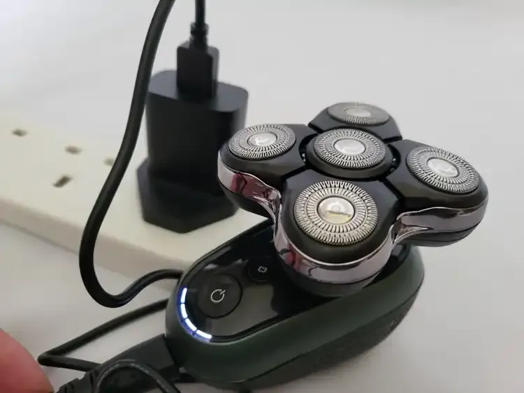 photo of charging the Remington RX7 Head Shaver and LED on