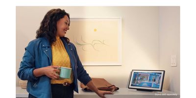 photo of a woman drinking coffee and talking on Echo Show 15