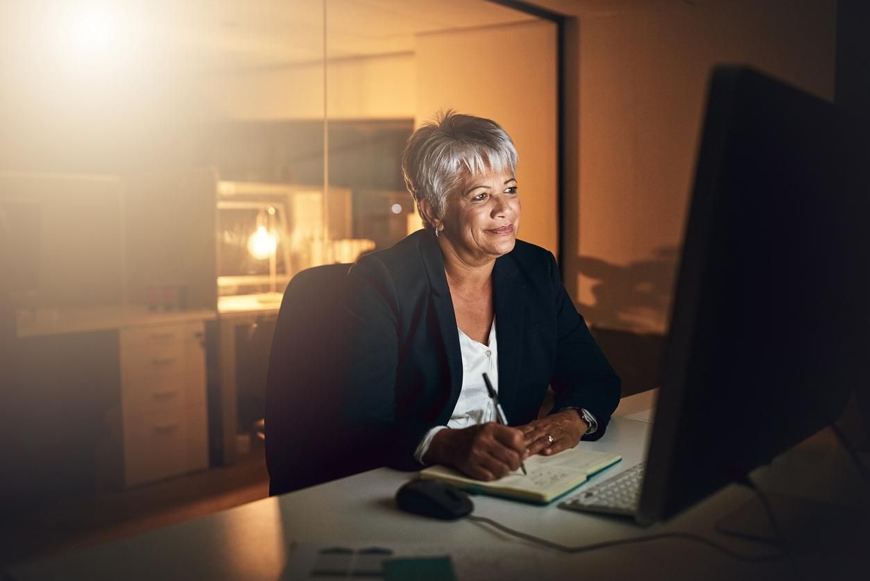 a photo of a woman transcribing a document