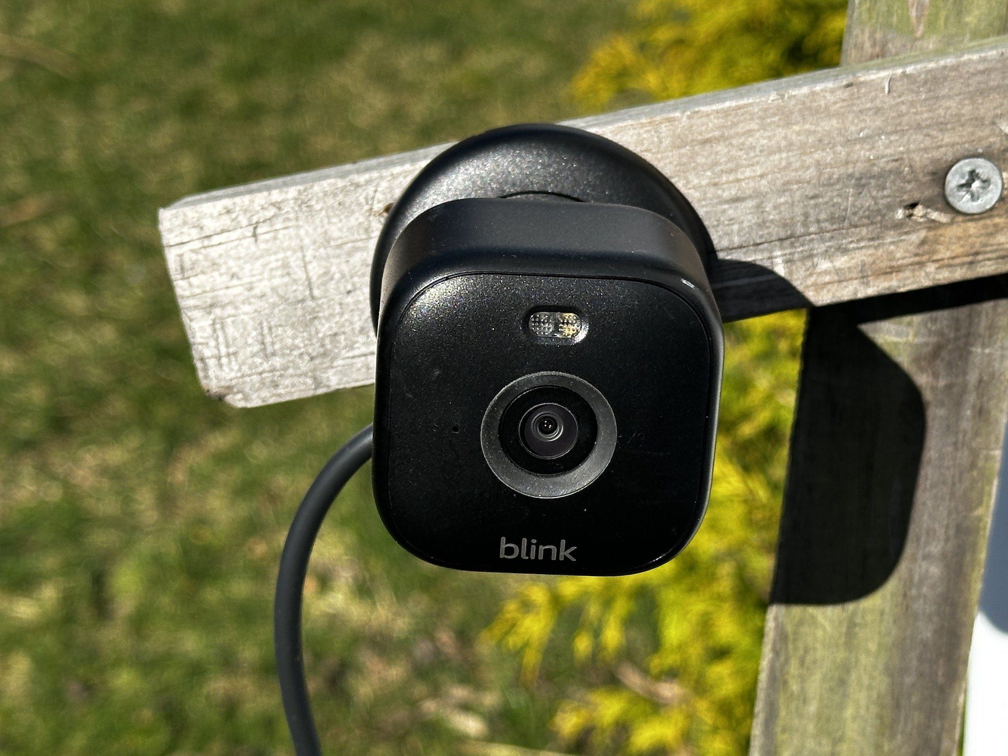 a photo of Blink Mini 2 Indoor/Outdoor Plug-in Smart Security Camera installed outside