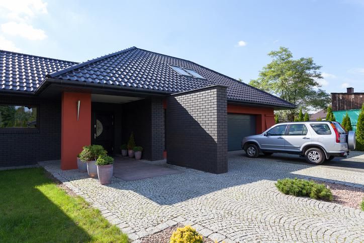 A car parked at home in a driveway