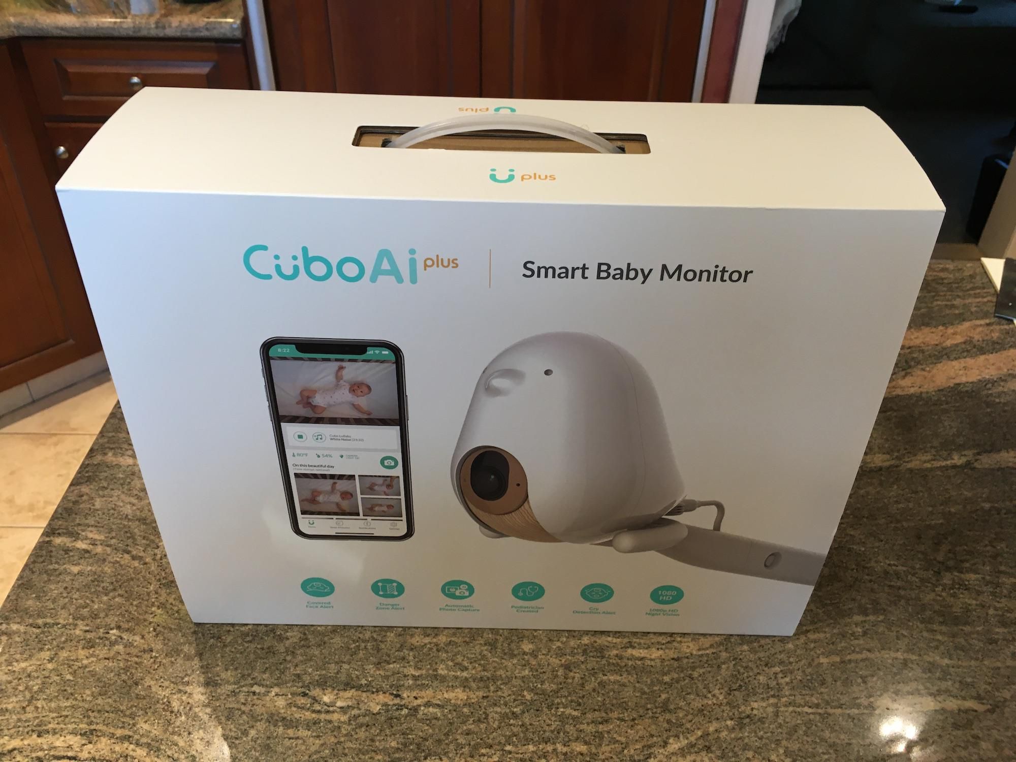 Cubo AI Plus Smart Baby Monitor in a box on a counter.