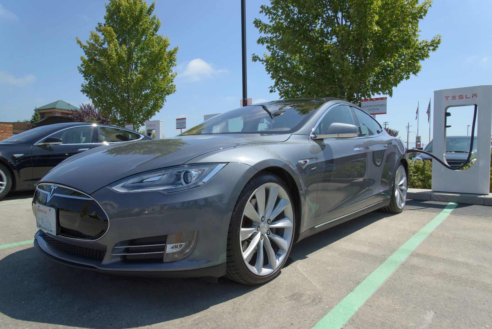photo of a tesla car being charged