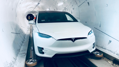 a photo of a Tesla in a boring tunnel