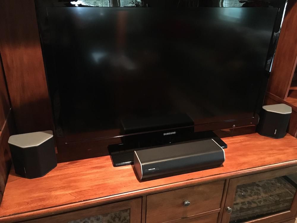 Photo of Enclave CineHome II Wireless Home Theatre System infront of a smart tv.