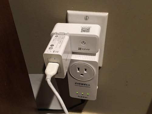 EZVIZ T30 Smart Plug in a wall outlet.