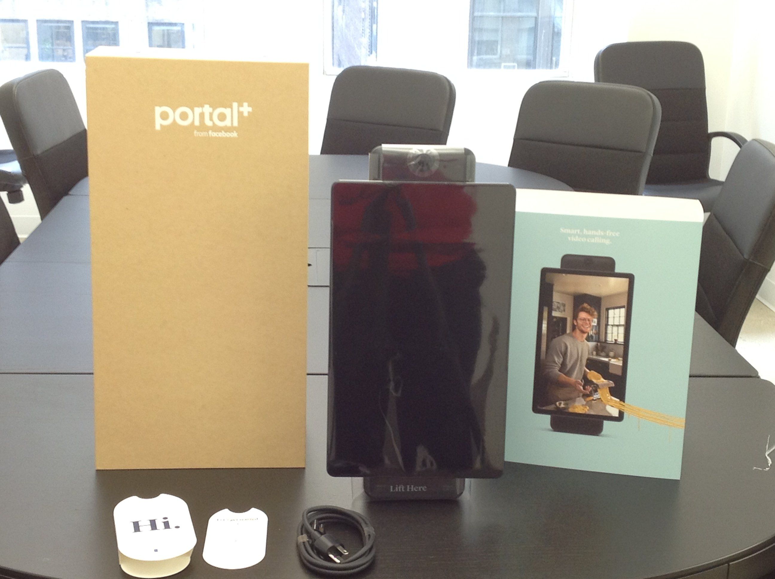 A photo of Facebook Portal Plus unboxed on a conference table