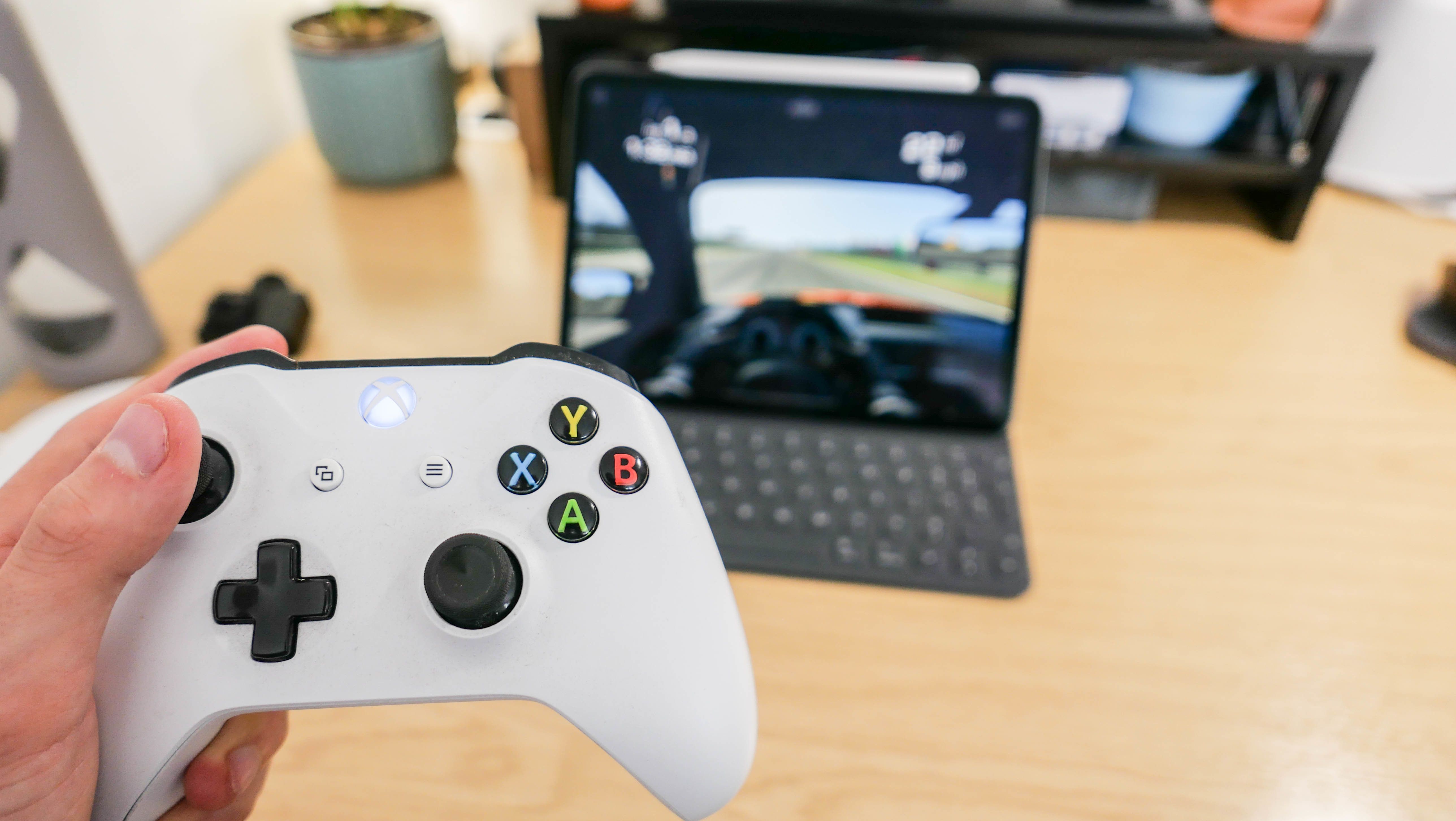 Photo of an Xbox One controller and iPad Pro