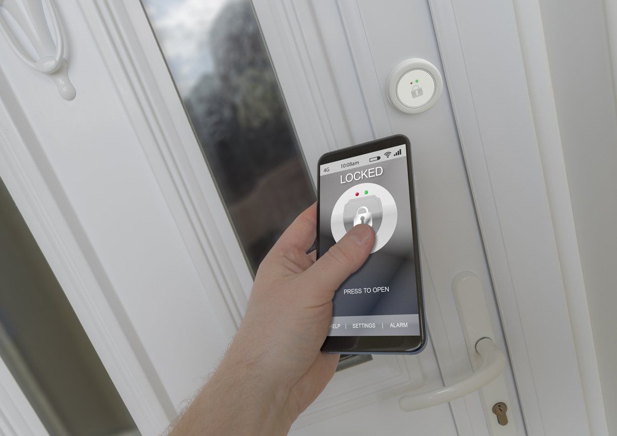 a person using a smartphone to unlock a smart lock