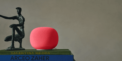 photo of Google Home Speaker on a pile of books