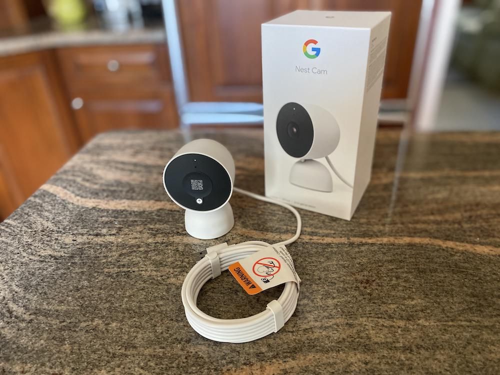 Google Nest Cam 2nd Generation Indoor Wired Security Camera and box on a countertop