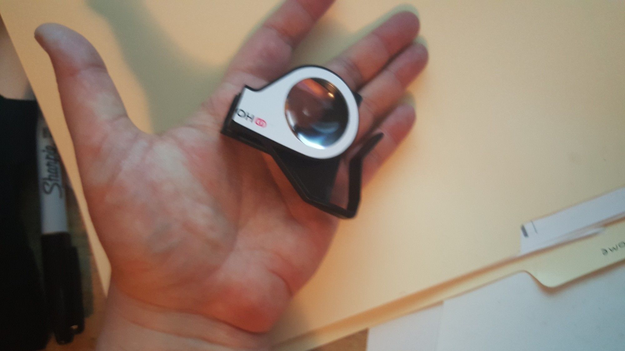 a photo of Homido Miini VR Headset in a person's hand