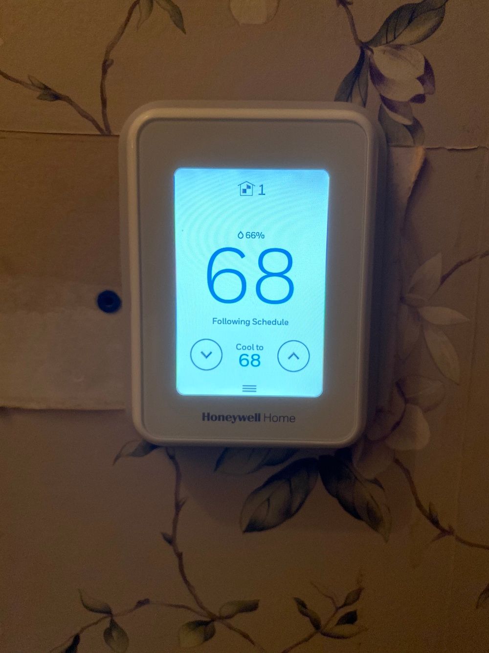 Photo of Honeywell Home T9 Smart Thermostat on a wall.