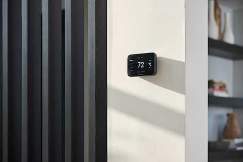 photo of Honeywell Home X8S Smart Thermostat installed on a wall inside a home.