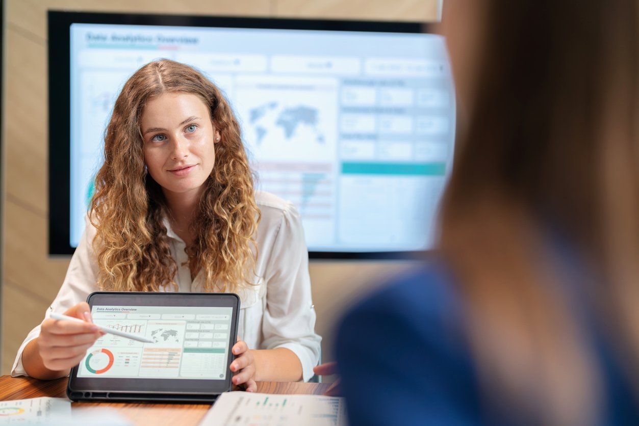 Cultivate members in the organization to share idea to develop the organization to advance. Executive business development team brainstorming and share idea on the new project using digital tablet. Businesswoman manager present the market trend stock photo
