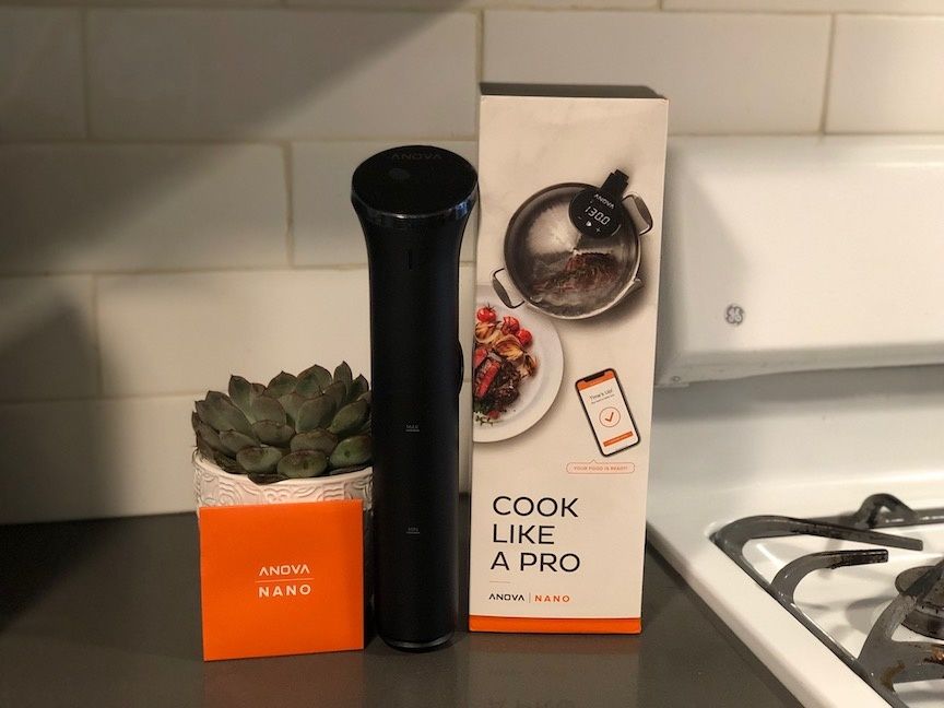 a photo of Anova Nano and box on a kitchen counter.