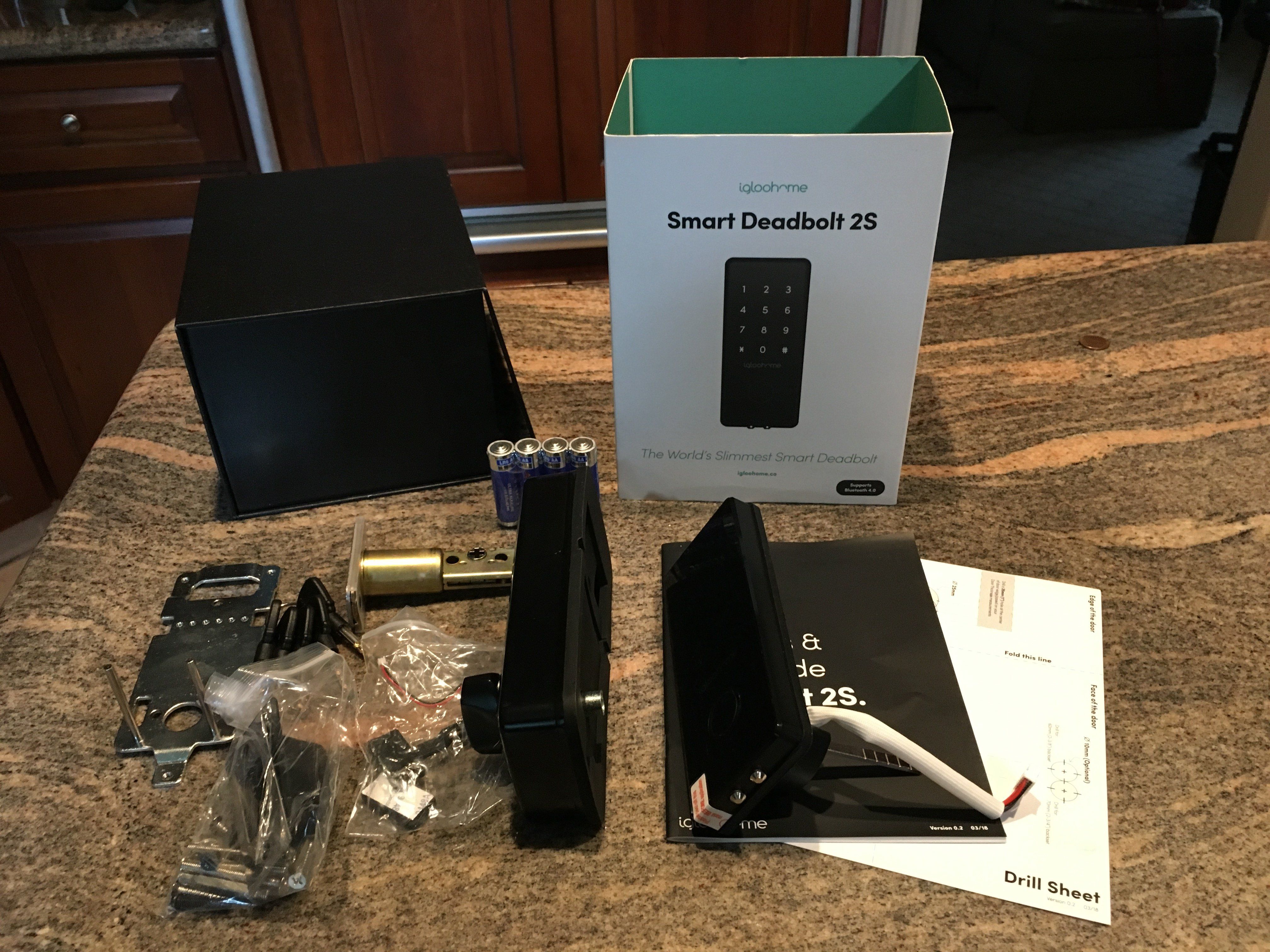 Photo of igloohome deadbolt lock unboxed on a countertop