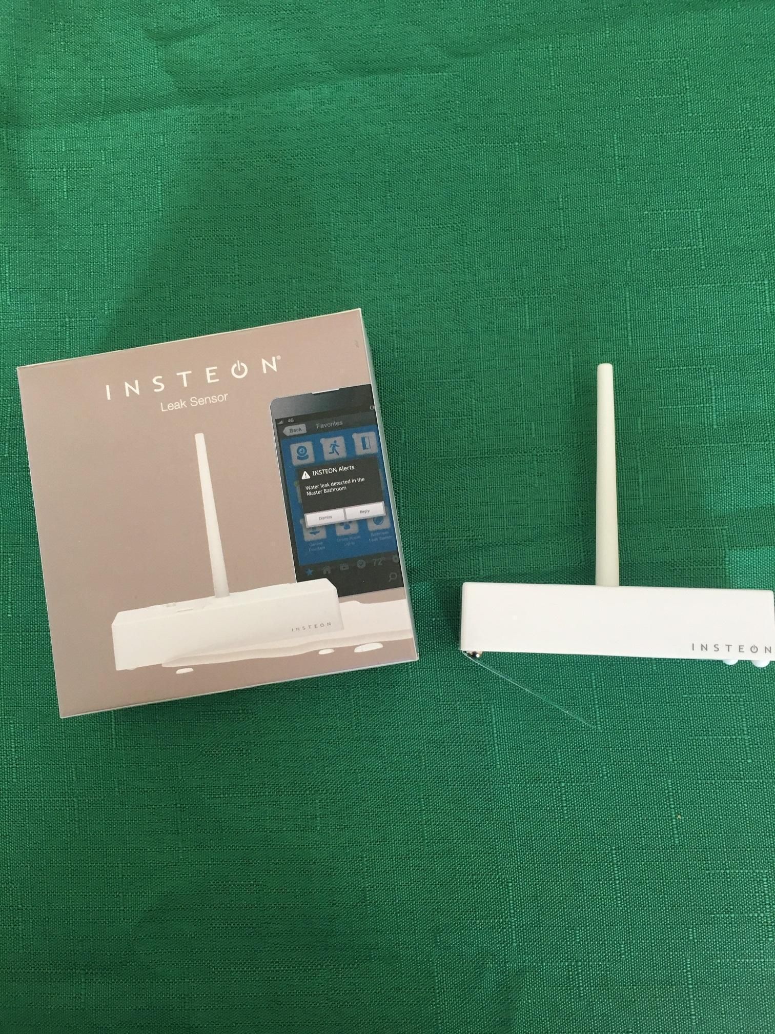 A photo of Insteon Water Sensor and box on a countertop