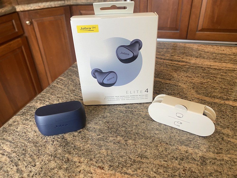 a photo of Jabra Elite 4 ANC Wireless Earbuds on a countertop unboxed.