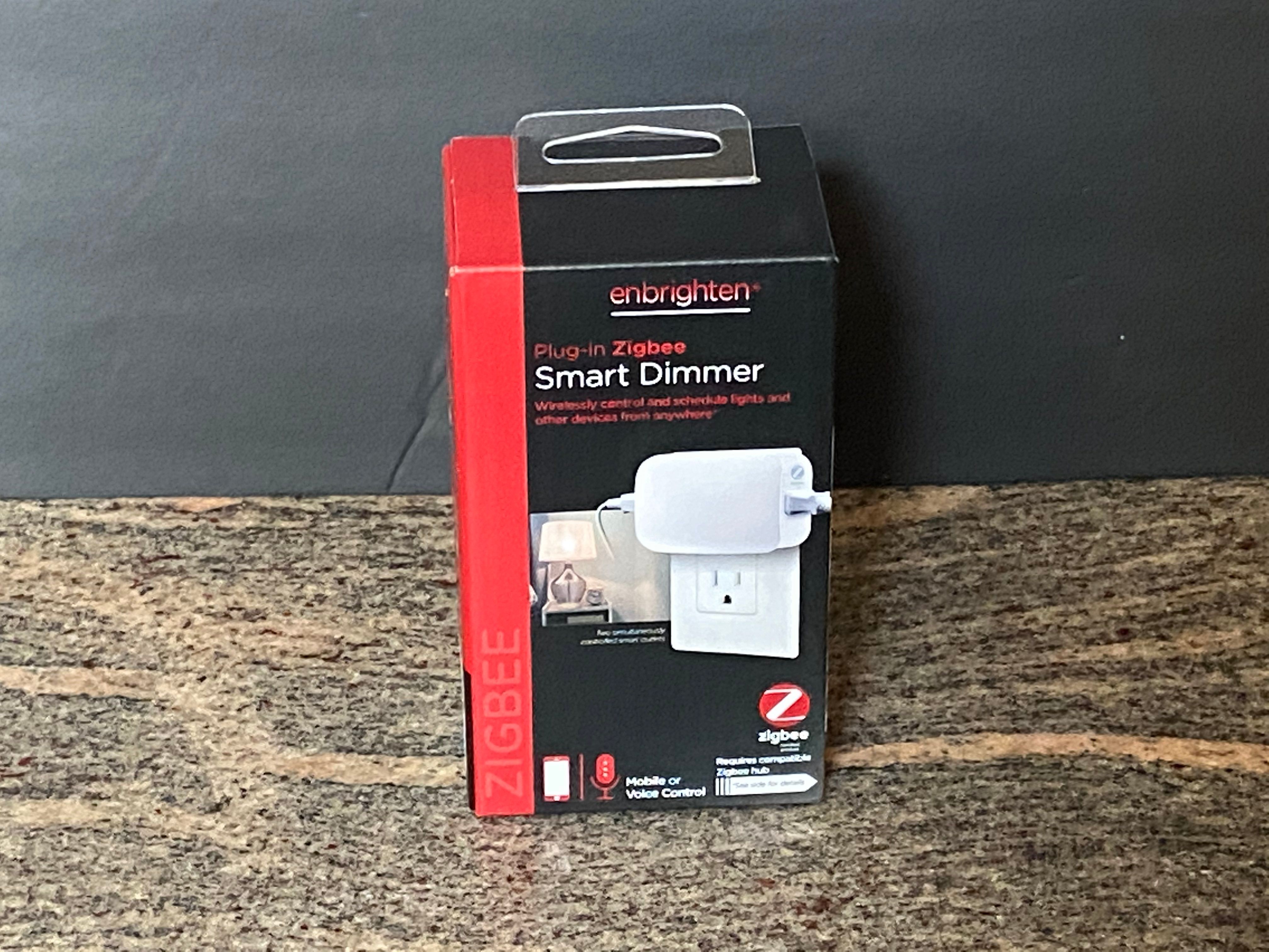 Jasco Enbrighten Plug-in Smart Dimmer in a box on a counter