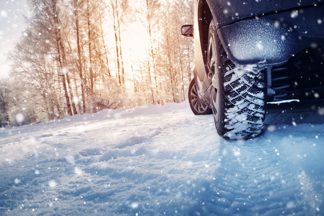 Car driving on a snow-covered road