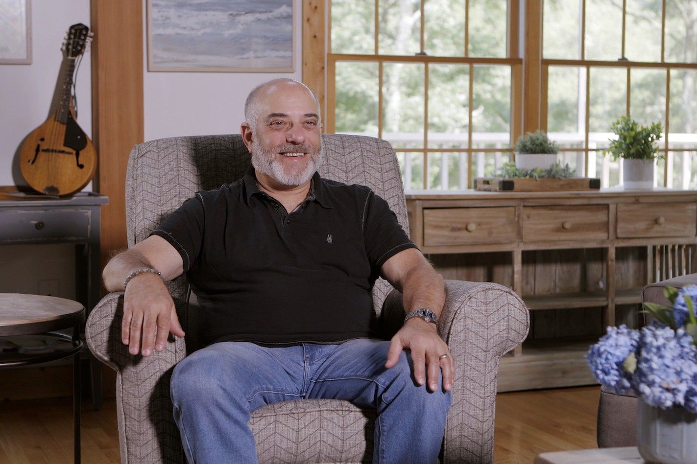 Executive director Mitchell Klein for the Z-Wave Alliance in an arm chair, smiling