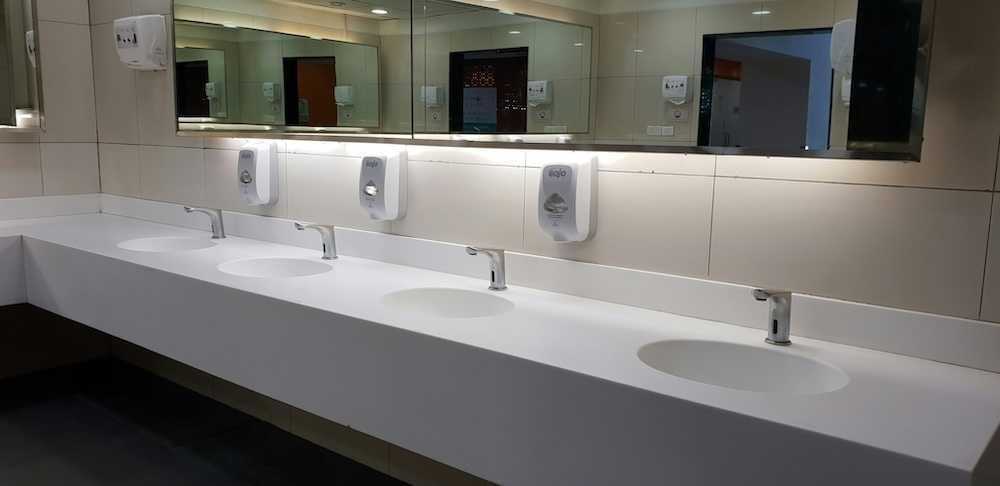 commercial bathroom counters faucets lighting